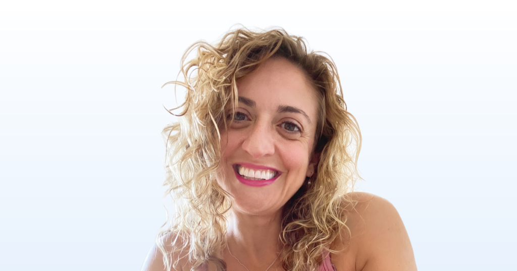 Michelle Santagate portrait on a light blue gradient background