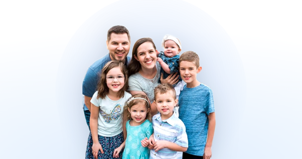 J House Vlogs family portrait on a light blue gradient background