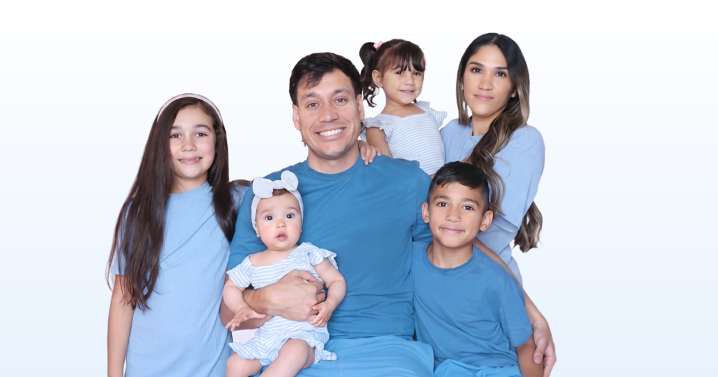 Jancy Family portrait on a light blue gradient background