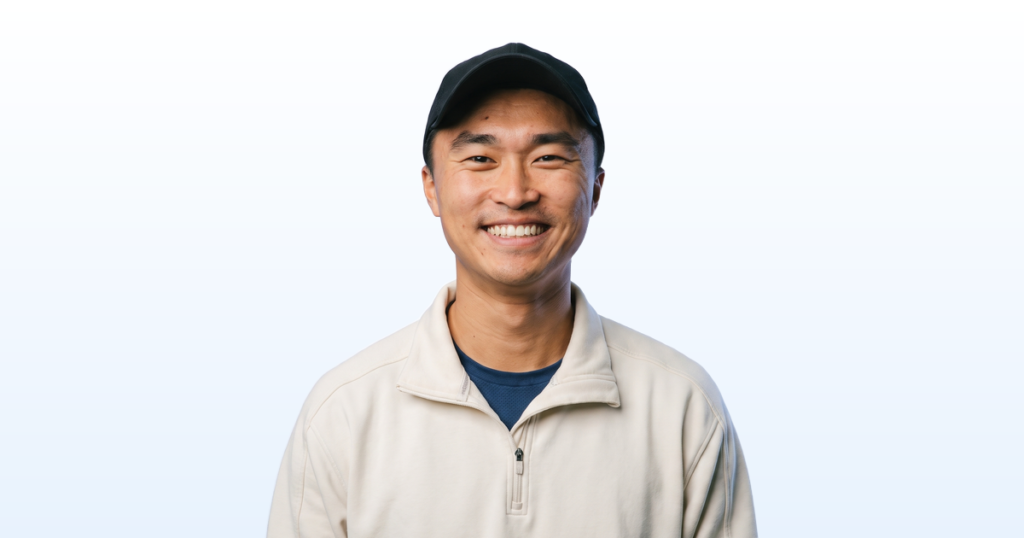 Kevin Dong portrait on a light blue gradient background